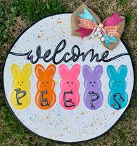 Dress up your front door for Easter with this cute lightweight wood handmade Easter Welcome Peeps door hanger! A perfect treat for your home or as a gift! This listing is for one hand painted door hanger that is ready to hang with a sturdy metal wire. Item includes an attached hand crafted matching bow. This door hanger is made from 1/4 inch wood and is sealed with a protective coating to protect against the elements. Please note that this item will have greater longevity if on a covered porch a