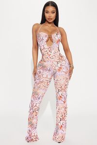 Available In Blue/combo And Rust. Jumpsuit Halter Sleeveless Keyhole Cut Out Hardware Lined Stretch Inseam= 34" Disclaimer Print Placement May Vary Self: 95% Polyester 5% Spandex Lining: 95% Polyester 5% Spandex Imported | Wild Gal Mesh Jumpsuit in Rust size Medium by Fashion Nova