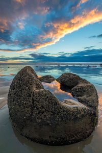 I photographed this unique reflection on Moeraki Boulders Beach on the South Island of New Zealand. The rainwater trapped in the boulder reflected the sky, and the ocean reflected the sky as well but ...