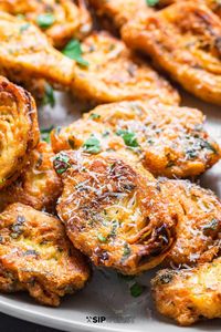 Italian fried artichoke hearts are the easiest and best appetizer! Egg and parmesan battered, the hearts are fried until golden and crisp. They're the perfect bite-sized addition to any appetizer spread! #artichokes #appetizers #italianfood