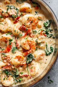 Creamy Garlic Butter Tuscan Shrimp coated in a light and creamy sauce filled with garlic, sun dried tomatoes and spinach! Packed with incredible flavours!