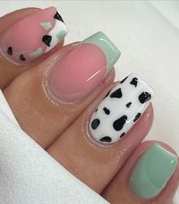 Elevate your manicure game with these chic sage green nail designs! Find inspo and ideas that are perfect for spring – just like these short sage green nails with a cow print design!