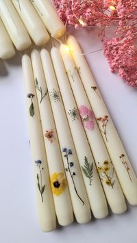 "Beautiful 10\" tapered Ivory candles with real pressed flowers. They will make your wedding table set-up unique & stunning! They can be made with different mix flowers and leaves or if you prefer a certain colour theme please message before placing the order to discuss availability of flowers. Time of burning - 7.5 hours. Never leave burning candles unattended."