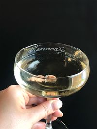 There's beauty in simplicity! And so it is with this graceful custom champagne coupe glass, beautifully hand engraved in calligraphy. As the personalized engraving is on the outside, you can view the beautiful engraving while sipping on your champagne, daiquiri or French 75. It feels good to hold, has a nice weight to it and has a foot for stability. The engraving can be filled with gold ("Felicia"), rose gold ("Austin"), or silver ("Kennedy") for extra luxe, or kept bare if desired (looks like