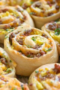 These Breakfast Rolls are filled with sausage, bacon, eggs and cheese! They're hearty & filling - the best way to get the day started!