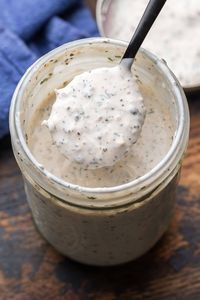 This easy Creamy Parmesan Peppercorn Dresssing comes together in minutes and is so much better than anything you'll buy at the store! Toss it with garden salads or serve as a dipping sauce with fresh veggie crudites. #dressing #parmesanpeppercorn