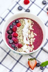 A vibrant blend of three berries and protein-rich ingredients, this Triple Berry Smoothie Bowl is a nutritional powerhouse!