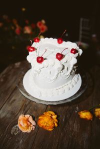 Maraschino cherries are a common decoration for Lambeth-style wedding cakes, including heart-shaped ones. See more trending heart-shaped wedding cake ideas at the link.