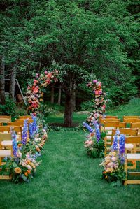 Love bright wedding florals? | Vermont Weddings | Explore the colorful wedding flowers in this intimate castle wedding. Get inspiration for a wedding flower arch, wedding flower bouquets and floral table settings for your wedding here: https://vermontweddings.com/blog/castle-wedding-vermont/