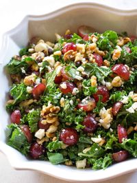 This Grape and Feta Kale Salad is a healthy sweet and salty salad filled with grapes, walnuts, and feta topped with a honey vinaigrette. #grape #feta #salad #recipe #healthy