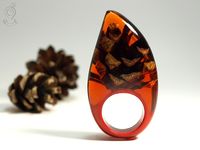 Beautiful amber color resin with pinecone handmade ring jewelry.