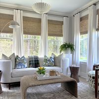 An enclosed sunroom will give you all the delights of a screened in porch but without the insects that can ruin your glass of wine! We love doing sunrooms!  Reach out today for a quick call to see what we can do for you! #sunroomdesign#cozylivingroomideas#lightingideas #wovenshades #arearug #indoorplants #blueandwhite #plaidpillowcover #whitecurtains#boucle#sunroom#sunroomideas #accentchair #kitchenreno #sunroomidea#porchdecor #mydomaine #sodomino #coastal #whitesofa#coastalvibes #coastaldesign