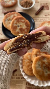 DOUGH 2 teaspoons instant yeast 3/4 cup water, lukewarm 1/2 cup whole milk, lukewarm 1 1/2 tablespoon white sugar 1 teaspoon salt 2 1/3 cups all-purpose flour, more as needed 1/3 cup mochiko flour 1 tablespoon unsalted butter, melted FILLING 1/2 cup brown sugar 2 teaspoons cinnamon 1/4 cup chopped peanuts, optional OTHER vegetable oil, for frying. Video credit: @moribyan (TikTok)