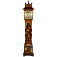 A good quality Chinese Chippendale style chinoiserie lacquer grandmother clock. Having a pagoda style hood, brass faced, eight-day movement. The case having gilded classical oriental scenes. Retailers; Maples, London.