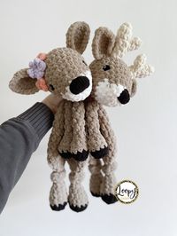 "*Crocheted baby buck or doe lovey, perfect for snuggling!! Made with squishy blanket yarn! *Choice of safety or embroidered eyes. Safety eye back is reinforced with hot glue for extra security.  *Choose your own flower colors for the doe! *Approximately 17\" long. ‼️While care is taken to ensure all pieces are secured appropriately, children under 3 should be supervised with safety eyes‼️ ((Modified from MamaMadeMinis pattern))"