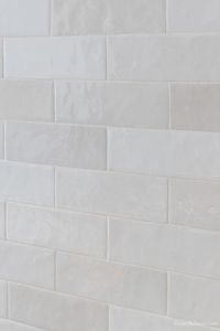 Polished subway tile on kitchen backsplash