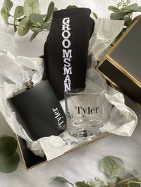 Our personalized groomsmen proposal boxes are absolutely stunning and completely ready for your presentation as a proposal box or thank you gift box! Each box includes the following: - personalized heavy bottom 10 ounce whiskey glass - black cotton crew socks (groom, best man or groomsmen) - 8 ounce personalized hip flask with shot cup - tissue paper  - personalized lid (top & inner box lid) If you have any questions or would like more information please send us a message!  Thank you for visitin