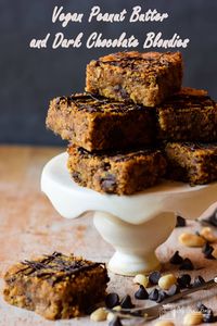 Gluten free and vegan, these Peanut Butter  Dark Chocolate Blondies are soft and yielding with a clear peanut butter and chocolate flavour. The blondies are packed with flavour, so even if you're not needing to follow a free-from diet this vegan blondie recipe is definitely one to try. #onlycrumbsremain #glutenfreecake #vegancake #blondie