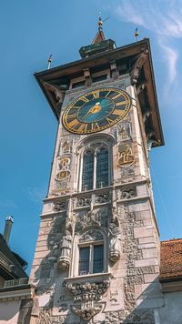 Historic Clock Tower: A stunning historic clock tower stands tall against a blue sky, showcasing intricate architectural details and craftsmanship. #architecture #historic #clock #tower #sky #blue #ornate #craftsmanship #aiart #aiphoto #stockcake https://ayr.app/l/bYnP