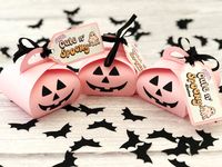 "Pink Halloween Treat Boxes, Halloween Party Favors, Halloween Favor Boxes, Halloween Favors, Treat Bags, Halloween Decor, Candy Box - Set of 10 These incredibly cute Pink Halloween Treat Boxes are perfect for your Halloween Candy! These Halloween Favor Bags are made of 80lb/220gsm textured pink card stock. The front of the box is decorated as a smiling pumpkin. A \"Cute n' Spooky\" tag is attached along with a 12\" black ribbon tie. You can write your message on the back of the tag. Size of eac