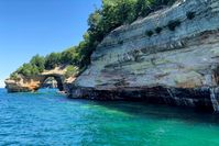 Munising, Michigan: Where you'll think 'this is Michigan?' a few times a day. Tour Pictured Rocks, hike to waterfalls + beaches, & more.