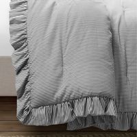 With its soft plush feel and classic ticking stripe design, this is a bedding set you'll want to stay cuddled up in all day. The homey look and ruffle edge of this comforter and sham set complements a farmhouse or cottage style perfectly.