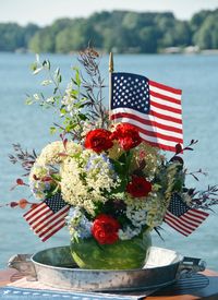 Watermelon vase centerpiece DIY | ©homeiswheretheboatis.net #patriotic #july4th #watermelon #recipes