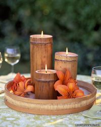 DIY bamboo candles add a tropical feel to outdoor reception tables