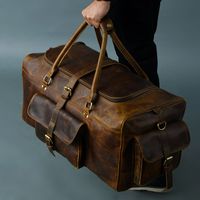 Goldman-II Travel buffalo leather duffel bag is the perfect weekend gateway partner for you because it is spacious, super stylish, and functional to carry all your travel necessities. This duffel makes a great carry-on for travel. Made from top-grain buffalo leather, this bag is handcrafted by skilled craftsmen to last for years. With a central compartment, this bag has enough space for carrying your clothes, shoes, accessories, etc. With 3 multiple pockets outside, you can better organize your