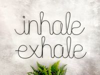 "You can be reminded every day to slow down, inhale, exhale and relax with our Inhale Exhale Wire Sign. Hang on a wall or set on a shelf for a modern touch to a bathroom, office, spa, bedroom or living room. This is my \"original\" font that is unique to only Emini Creations as it is based off of my personal handwriting. ------------------------------------------------------ Details: *Size Options: Small - \"inhale\" 3\"H x 11.5L, \"exhale\" 3\"H x 11.5\"L Medium - \"inhale\" 4\"H x 13.5\"L, \"e