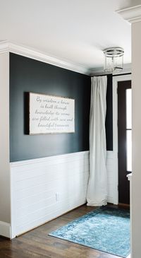 The wall paint color is Mount Etna SW7625 Sherwin Williams. Paneling is Sherwin Williams Snowbound. Interior Door Paint: Black Fox by Sherwin Williams.