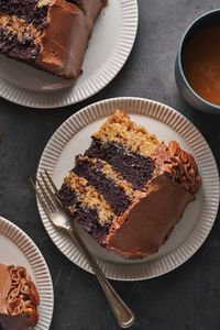 This Triple Layer German Chocolate Cake is a total showstopper! Featuring super moist cake layers stuffed with coconut pecan frosting and slathered in chocolate frosting... this recipe redefines decadence.