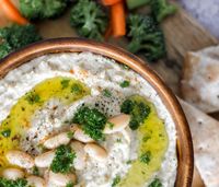 This Roasted Garlic & Herb White Bean Dip is made using white kidney beans, roasted garlic and the perfect amount of fresh herbs making it a creamy delicious easy to make appetizer or snack!