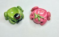 Handmade polymer clay worry stones shaped like frogs 