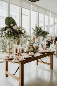 This Miami wedding had the most beautiful dessert table full of stunning cakes and pastries! The minimal and simplistic decor of greenery and wood tones makes for a gorgeous clean aesthetic!! 