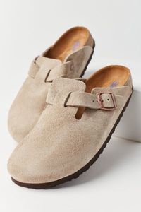 Birkenstock's Boston is a versatile classic clog that can be worn all-year round. The nature-inspired design features a soft suede upper which hugs the foot like second skin, and a soft footbed with an additional integrated foam layer that provides extra cushioned comfort. Includes one strap with an adjustable metal pin buckle.Features. Birkenstock Boston clogs Suede Birkenstocks in our fave style Easy slip-on fit Content + Care. Suede, cork, EVA Spot clean ImportedSize + Fit. Medium/Narrow widt