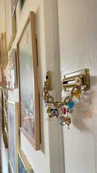 Dear Bungalow | Home Styling & Hosting | Made a charm bracelet for my home 💁🏻‍♀️🪩🎾🥠✨🧿♥️🔒 DIY charm bracelet • charms on door lock • door lock chain charms • girlhood • craft... | Instagram