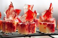 We hope you've been enjoying our week of creepy Halloween DIYs. From blood-splattered decor to anatomy pumpkins, we really have the creepy category covered. And for our final trick, we have another super creepy treat. Introducing our Blood-splattered Petit Fours stabbed with sugar glass shards.