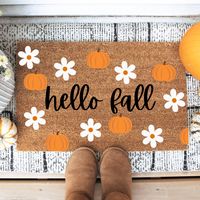 HELLO FRIENDS - FALL LEAVES DOORMAT PLEASE READ: This doormat is made to be outdoors, however, it should be kept in a sheltered area such as a patio. The mat shouldn't be saturated with rain, snow, etc. If the doormats are saturated then it can cause fading or discoloration. Please note that Divine Ivy isn't responsible for any damaged caused by using the mat incorrectly. MATERIAL: 100% Natural Coir front with PVC backing SIZE: 18" x 30" & 1/2 inch thick CARE: Shake vigorously to clean and refre