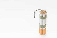 Bunch of cigarette with wick on white backdrop