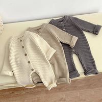 Introducing our cozy Infant Knit Romper, perfect for little ones aged 3 to 24 months. Crafted with love from soft and breathable cotton, this winter essential will keep your baby warm and comfortable. The unisex design features a classic O-Neck collar and a convenient single-breasted closure. With its solid pattern and long sleeves, this romper is both stylish and functional. Available in 3 adorable colors, it's the ideal choice for your little bundle of joy. Get ready to embrace winter with thi