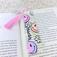 Personalized Bookmark, Acrylic bookmark, Custom Bookmark, book lover gift, Reader gift, Name Bookmark, Aesthetic Bookmark with Tassel, book club gift, Groovy Smiley Face Bookmark We offer beautiful custom-designed bookmarks that are perfect as wedding favors, gifts for mom or any special lady in your life, Also works great for booklovers and book club gifts.  Our bookmarks feature a retro smiley face design with daisies and stars on acrylic and can be personalized with the name of the recipient