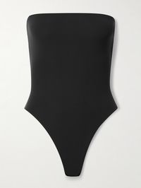 Find SKIMS Onyx on Editorialist. SKIMS' bodysuit is part of the label's 'Fits Everybody' collection that's loved for the way each design fits and flatters the figure. Made from stretch fabric, it has a strapless neckline with internal gumming to to keep it in place and thong base for seamless layering.