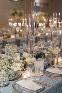 Wedding Reception Table Decor with Blue and White Flowers and Romantic Blue Candlelights || wedding decor, wedding aisle decor, centerpieces, centerpiece ideas, table centerpiece, table centerpieces, flower centerpiece, table centerpiece ideas, diy centerpieces, centerpieces for wedding, dining table centerpiece, table decorations wedding, wedding inspo, elegant centerpieces, tall wedding centerpiece, elegant wedding centerpiece, flower table centerpiece, wedding floral arrangement