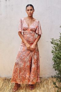 V neck tropical print satin maxi dress with elastic backed fitted bodice, front slit and ruffle sleeve Polyester fabric