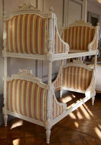 For Sale on 1stdibs - Louis XVI style bunk beds, hand carved and hand finished in an off-white, antique finish. Takes a mattress size: 90cm x 200cm (3ft x 6ft6'). The beds come