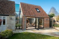 4-pane #aluminiumbifold door from #IQGlass installed to allow a clear opening of up to 90% providing homeowner access to the garden. #extension #structralglass #newbuildhome #homerenovation #homelinkl #glasslink