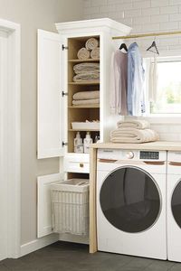 This linen utility cabinet has adjustable shelves and a removable hamper that make it a bathroom essential.