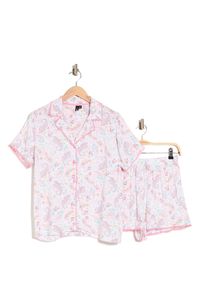 Feel cute and cozy day or night in these adorable boxer short pajamas covered in an allover pattern. Top has front button closure; short sleeves; notched collar Shorts have elastic/drawstring waist 100% rayon Hand wash, tumble dry Imported