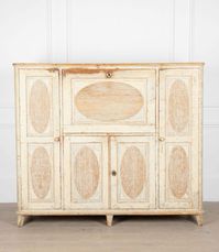 Magnificent 19th Century Gustavian period buffer of large proportions.

With original paint, this buffet features a fall front desk with decorative oval-reeded panels.

A very useful decorative storage piece.